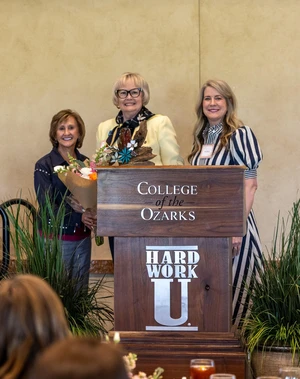 three women smiling at camera